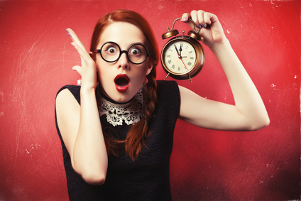 For her too, Time is Money. Redhead girl with clock.
