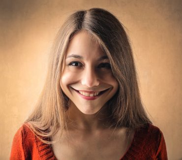 Why Do Americans Smile So Often and So Brightly?